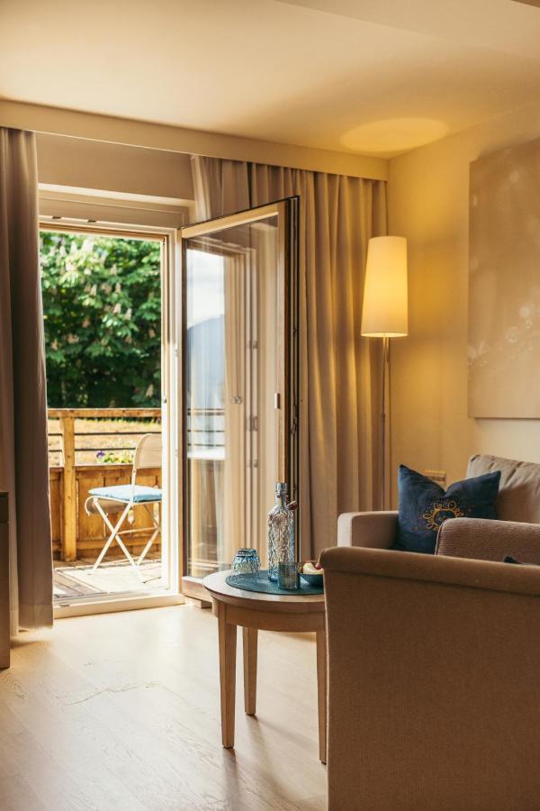 Strandhotel Am Weissensee Bagian luar foto